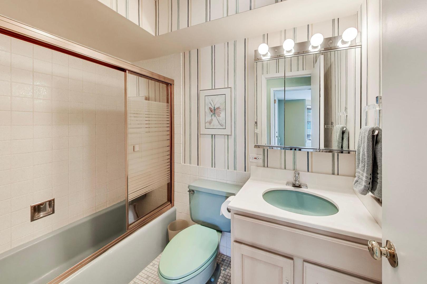 400 Ascot Drive, Unit 1M Park Ridge, IL 60068 - Photo 26 of 37 a bathroom with a sink a toilet and shower