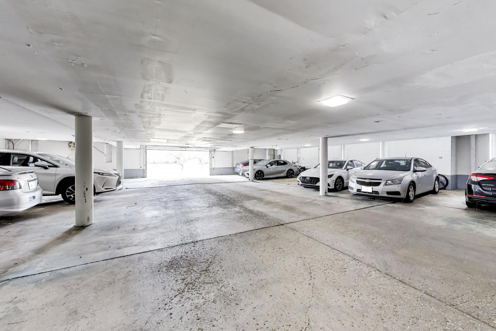 400 Ascot Drive, Unit 1M Park Ridge, IL 60068 - Photo 29 of 37 a view of parking area with parked cars