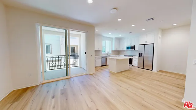 a view of kitchen with wooden floor