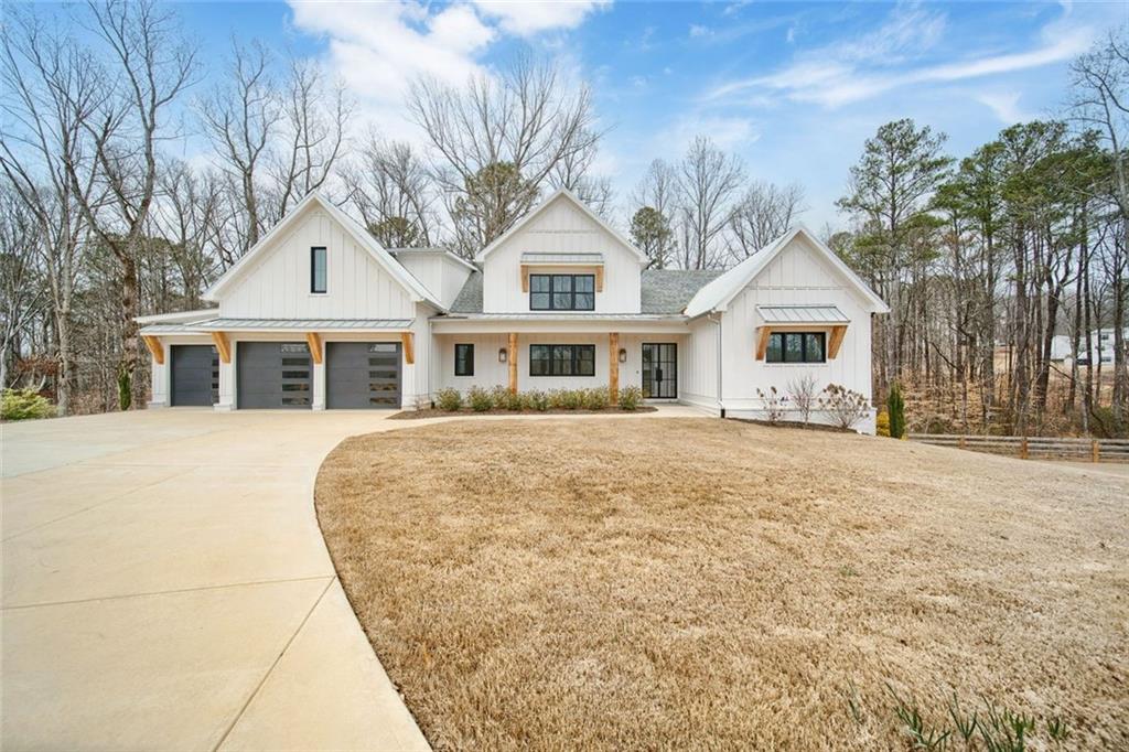 555 Lower Birmingham Road Canton, GA 30115 - Photo 13 of 104 a front view of a house with a garden