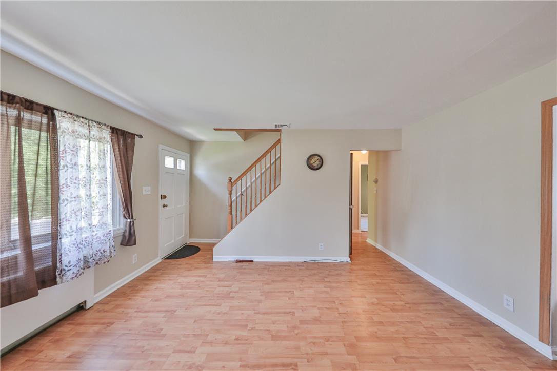 3050 Cornwall Road Bethlehem, PA 18017 - Photo 8 of 80 Natural wood flooring complements the welcoming entryway and staircase of this appealing living space.