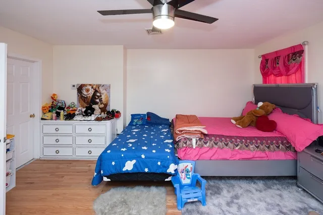 a bedroom with a bed and a dresser