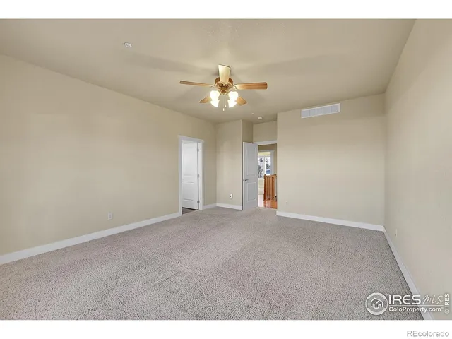 a bathroom with a granite countertop sink toilet a mirror a bathtub and shower