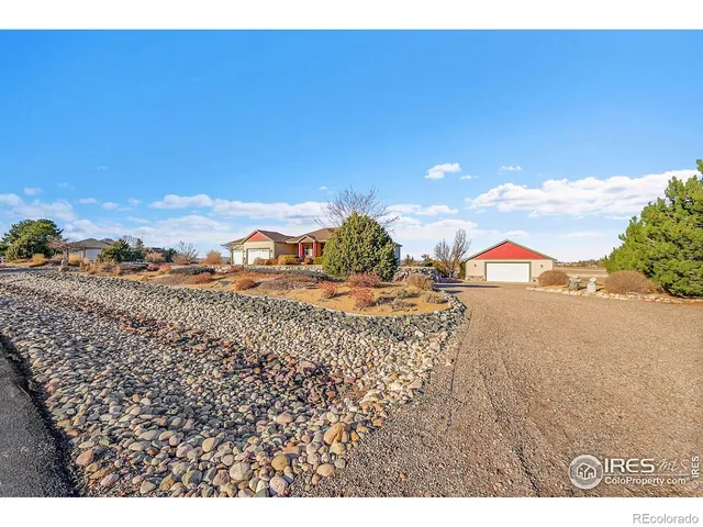 a large living room with stainless steel appliances kitchen island granite countertop a large kitchen island attached withe living room