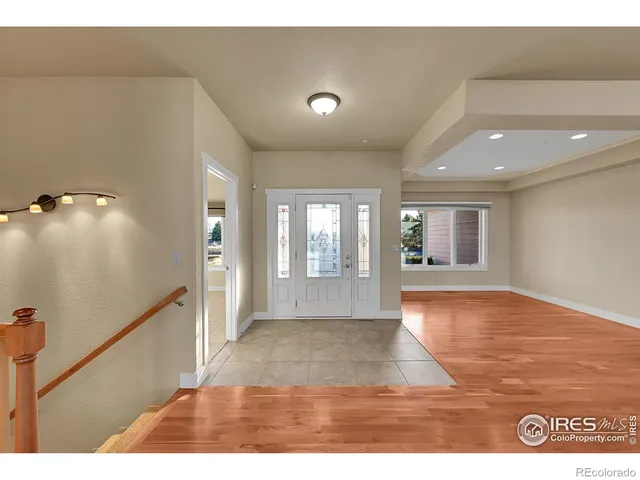 a kitchen with stainless steel appliances granite countertop a sink refrigerator and cabinets