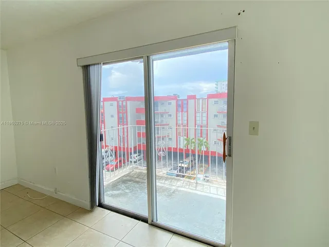a view of balcony with wooden floor and fence
