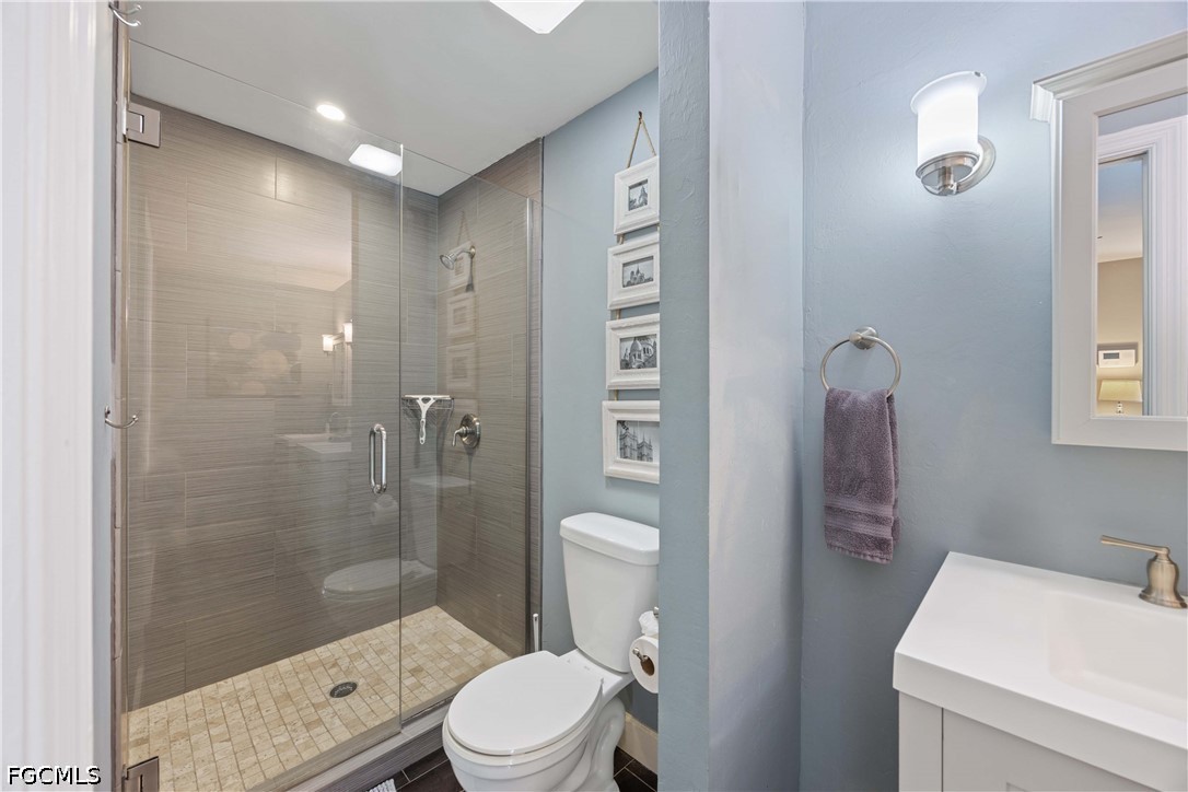 856 104th Avenue North Naples, FL 34108 - Photo 15 of 35 a bathroom with a sink a toilet and shower