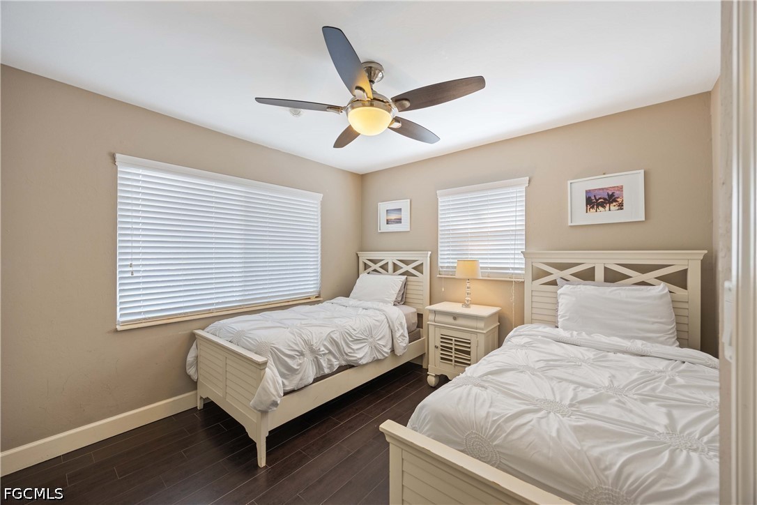 856 104th Avenue North Naples, FL 34108 - Photo 18 of 35 a bedroom with two separate beds and a window