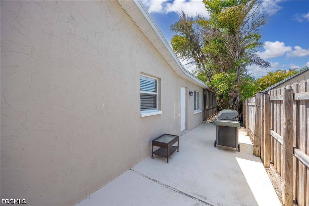 856 104th Avenue North Naples, FL 34108 - Photo 20 of 35 a view of a patio with furniture and a potted plants