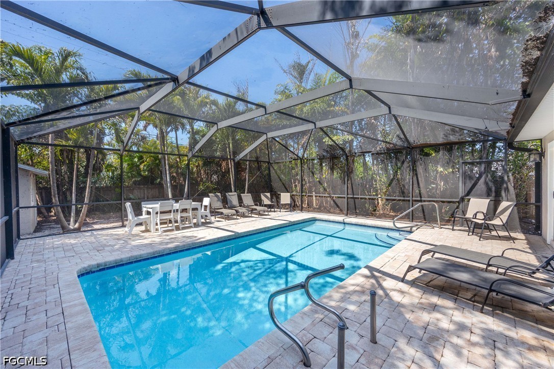 856 104th Avenue North Naples, FL 34108 - Photo 2 of 35 a view of a swimming pool with a patio