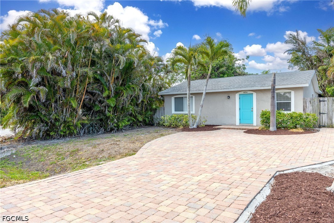 856 104th Avenue North Naples, FL 34108 - Photo 34 of 35 a front view of a house with a yard