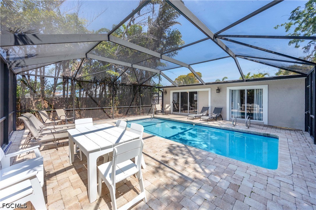 856 104th Avenue North Naples, FL 34108 - Photo 4 of 35 a view of a swimming pool with a patio