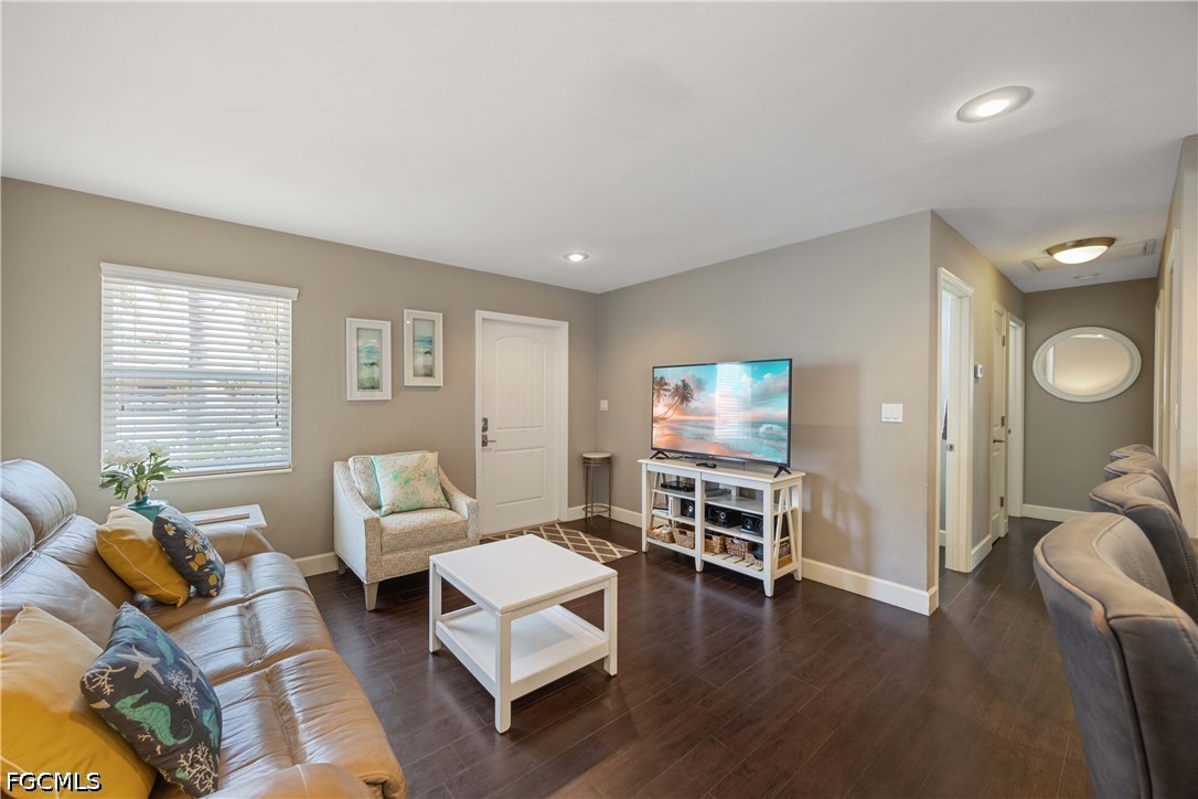 856 104th Avenue North Naples, FL 34108 - Photo 6 of 35 a living room with furniture wooden floor and a large window