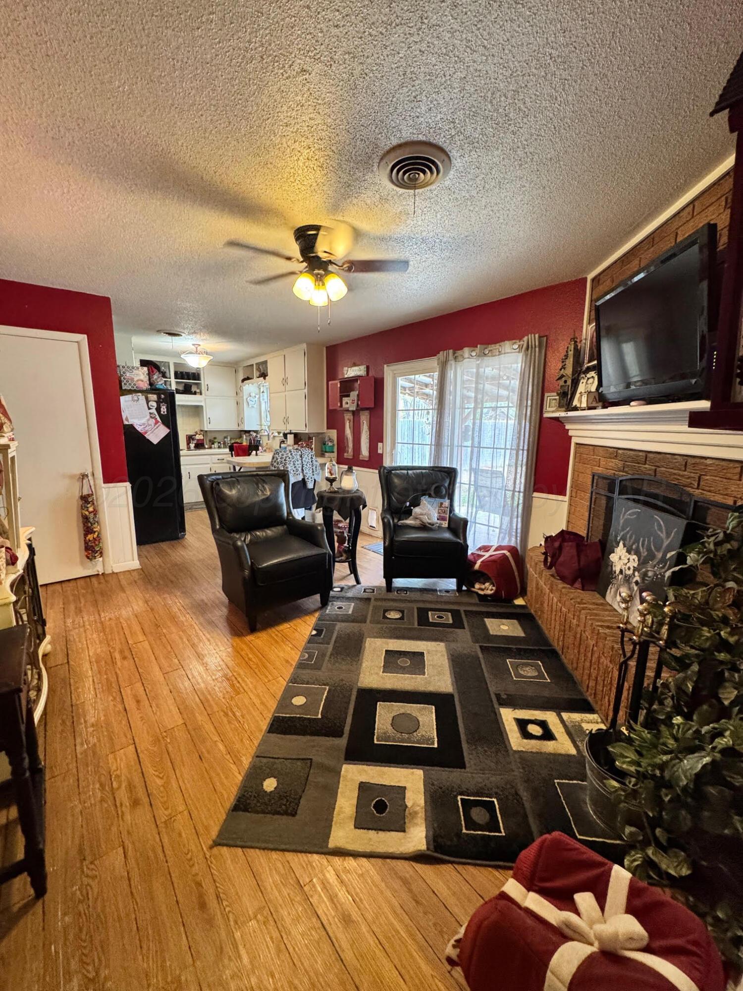 4705 Goodnight Trail Amarillo, TX 79109 - Photo 4 of 10 a living room with furniture and a flat screen tv