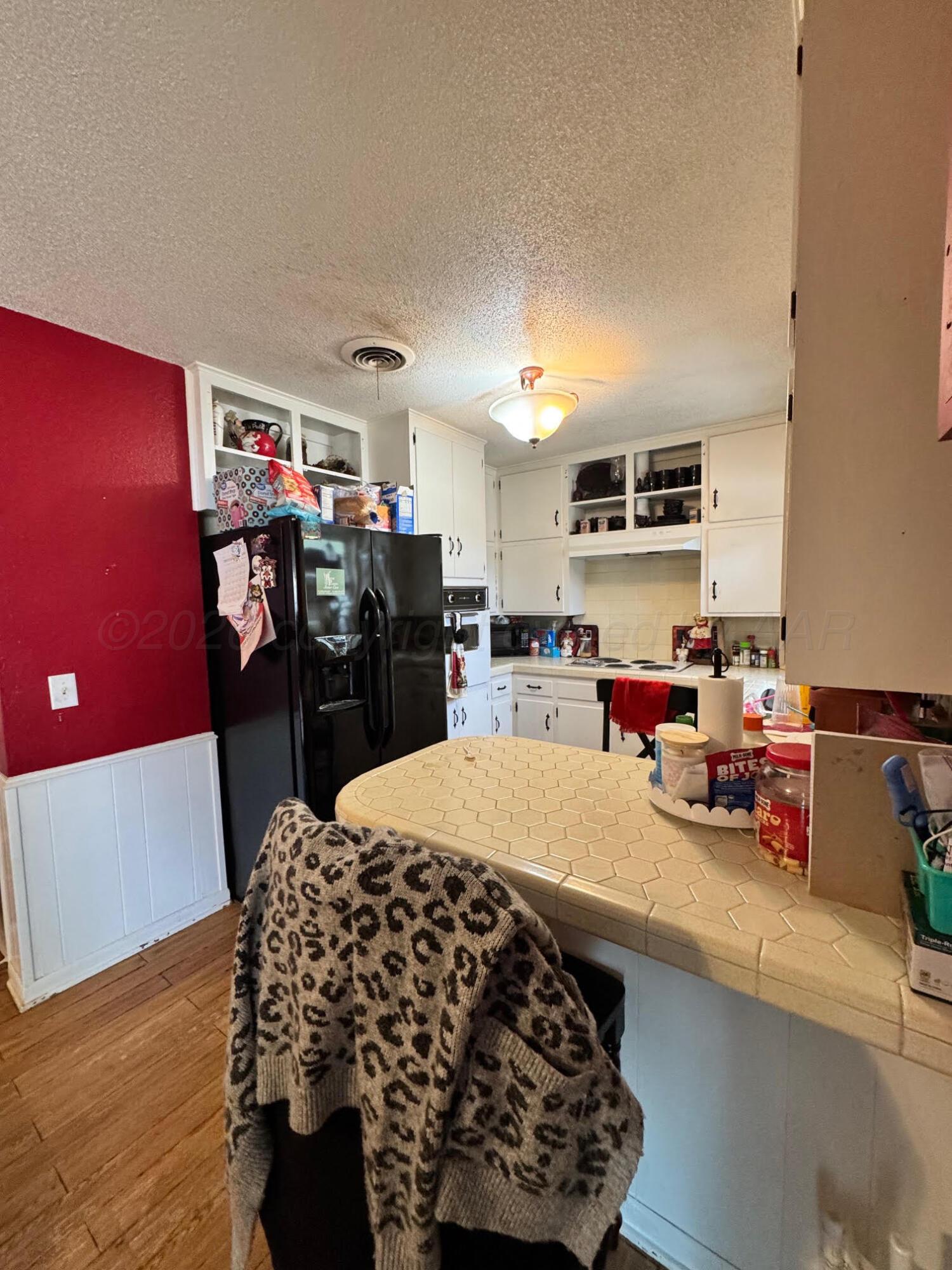 4705 Goodnight Trail Amarillo, TX 79109 - Photo 5 of 10 a bed room with a bed and a television