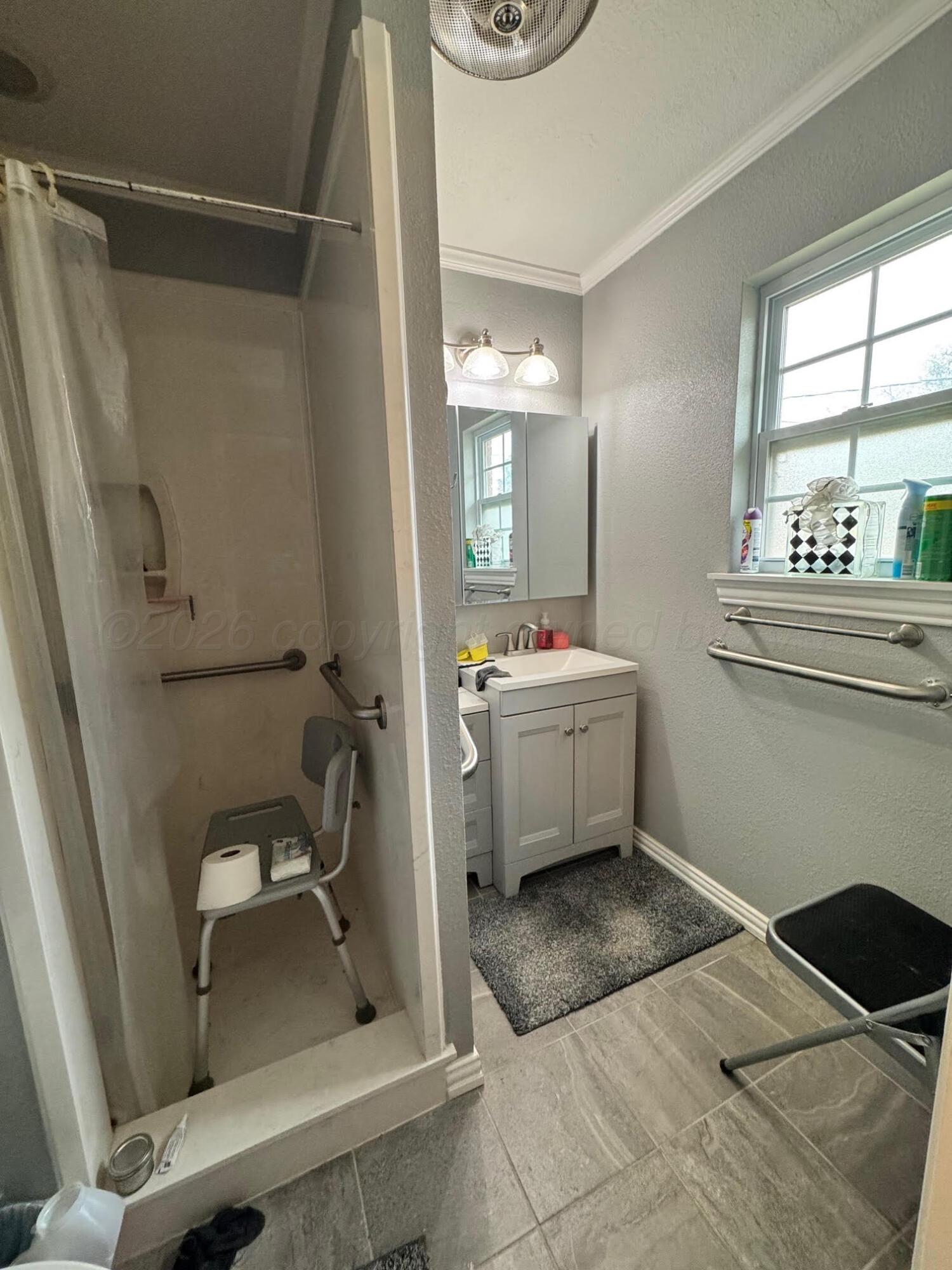 4705 Goodnight Trail Amarillo, TX 79109 - Photo 8 of 10 a bathroom with a sink a toilet and shower