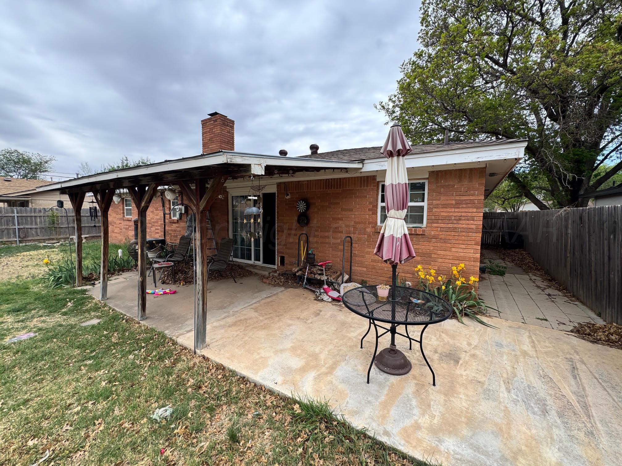 4705 Goodnight Trail Amarillo, TX 79109 - Photo 9 of 10 a view of a porch with furniture and a yard