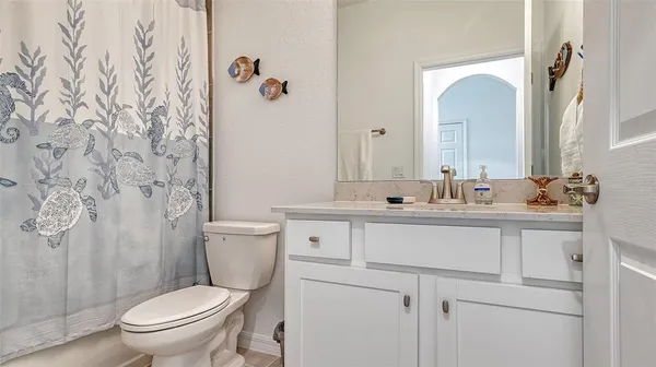 a view of a lake with houses in the background