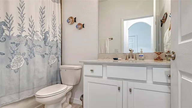 a view of a lake with houses in the background