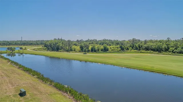 a view of a backyard with sitting area