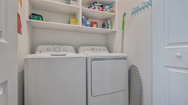 an aerial view of a house yard swimming pool and outdoor seating