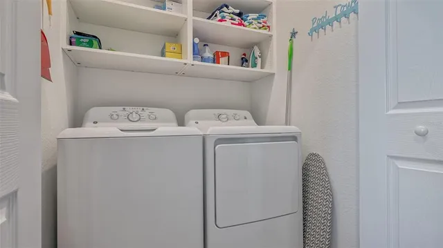 an aerial view of a house yard swimming pool and outdoor seating