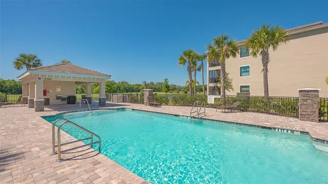 a view of a swimming pool with a yard