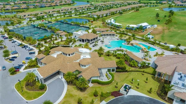 an aerial view of a house with swimming pool and outdoor space