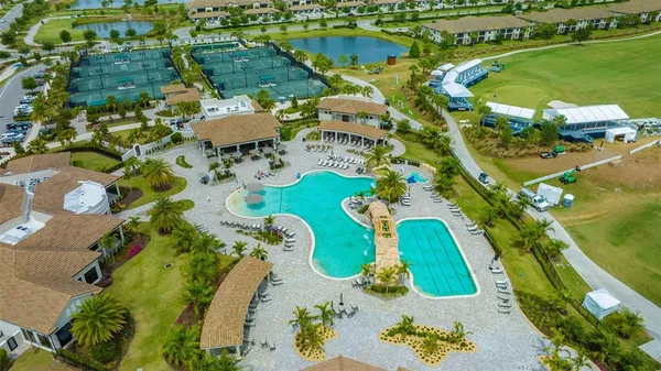 a view of a swimming pool with a table and chairs