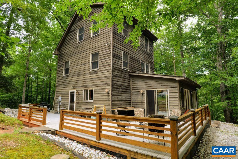1108 Berry Hill Road Nellysford, VA 22958 - Photo 11 of 32 a view of a house with backyard and sitting area