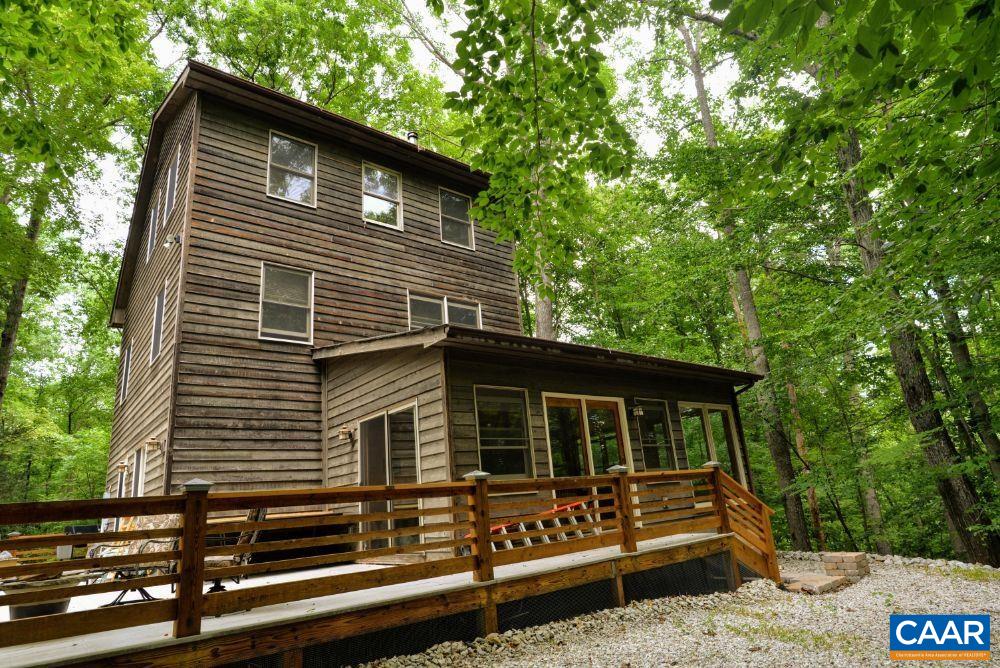 1108 Berry Hill Road Nellysford, VA 22958 - Photo 12 of 32 a front view of a house with garden