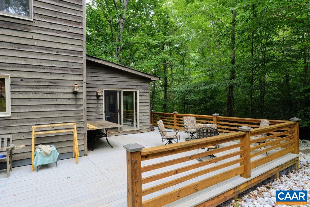 1108 Berry Hill Road Nellysford, VA 22958 - Photo 13 of 32 a view of backyard with seating space and deck