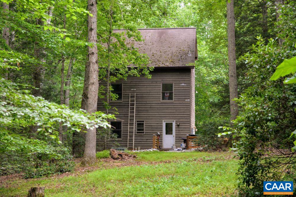 1108 Berry Hill Road Nellysford, VA 22958 - Photo 2 of 32 a backyard of a house with lots of green space