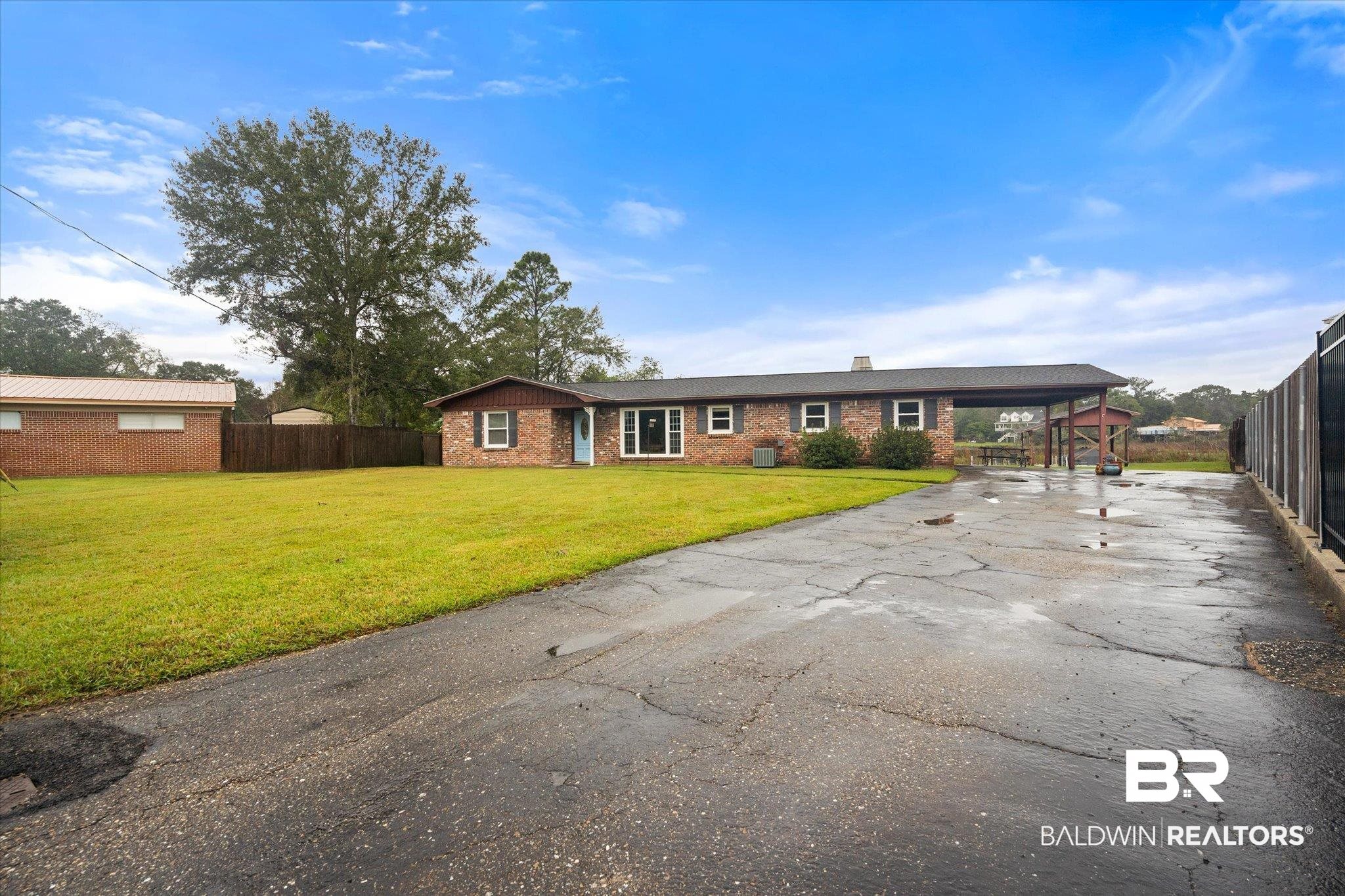 4570 Benson Road Mobile, AL 36619 - Photo 30 of 34 Ranch-style house with a front yard and a carport