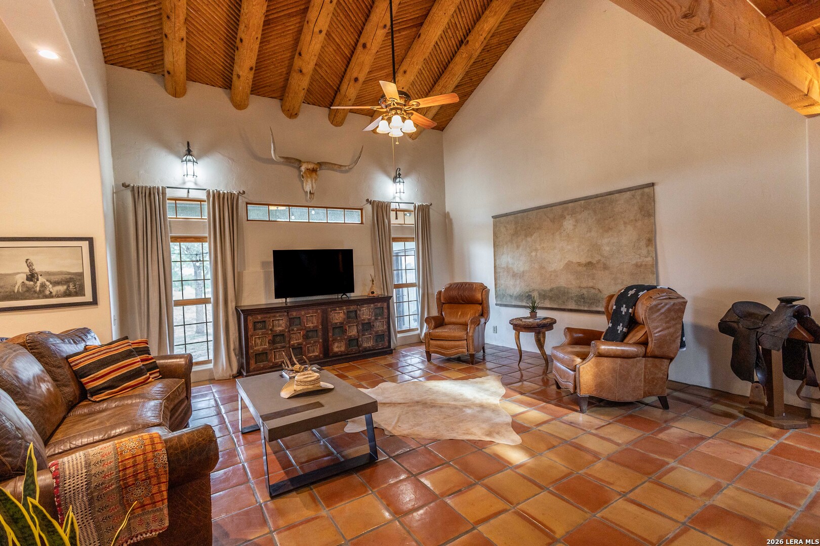5499 Agape Road Uvalde, TX 78801 - Photo 14 of 54 a living room with furniture and a flat screen tv