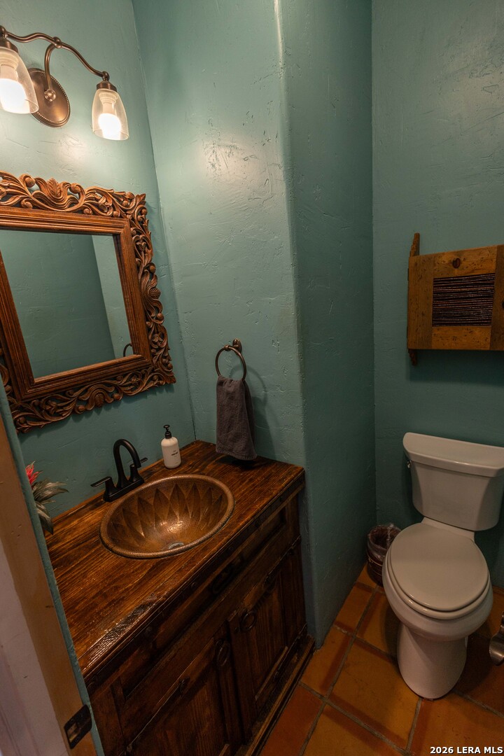 5499 Agape Road Uvalde, TX 78801 - Photo 27 of 54 a bathroom with a sink and a mirror
