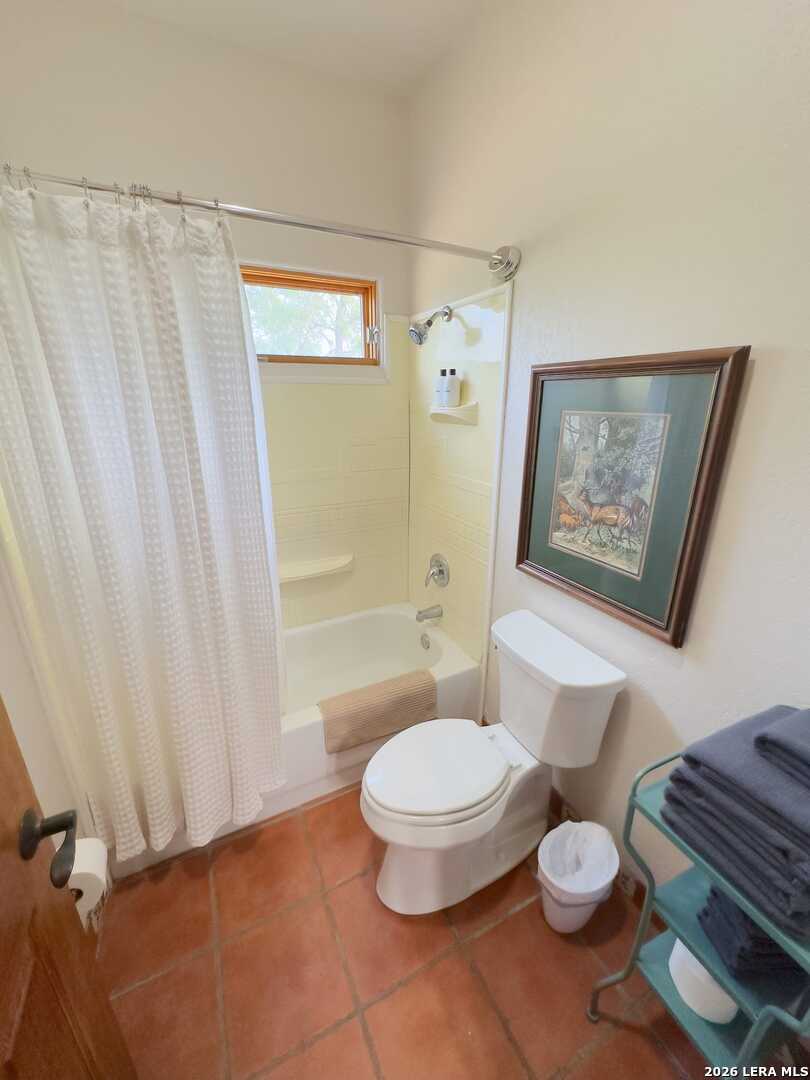 5499 Agape Road Uvalde, TX 78801 - Photo 39 of 54 a bathroom with a toilet and a shower