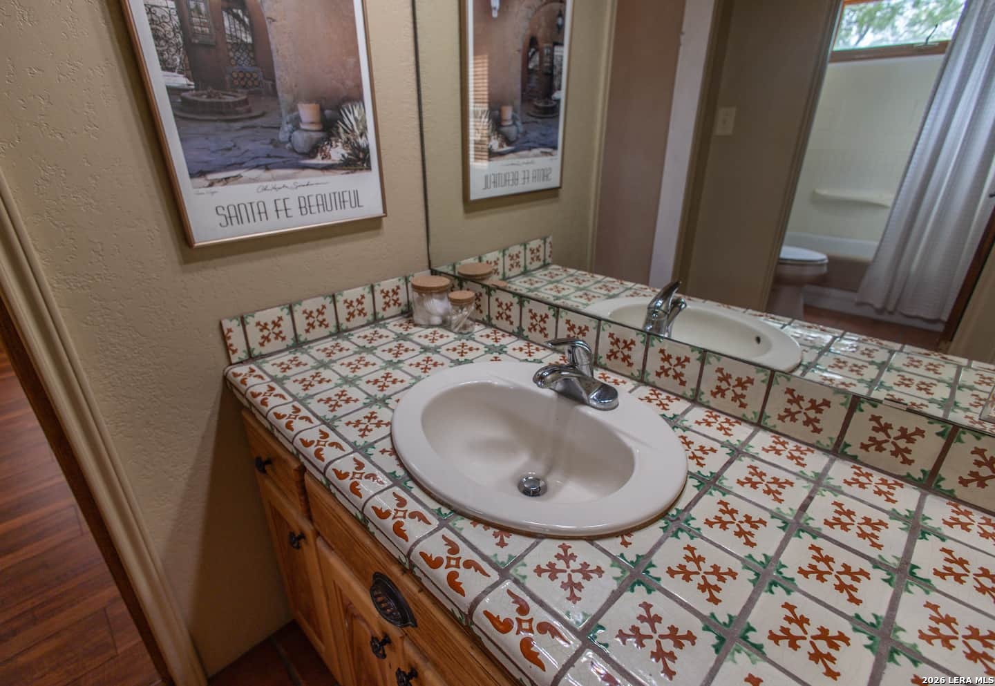 5499 Agape Road Uvalde, TX 78801 - Photo 40 of 54 a bathroom with a sink and mirror