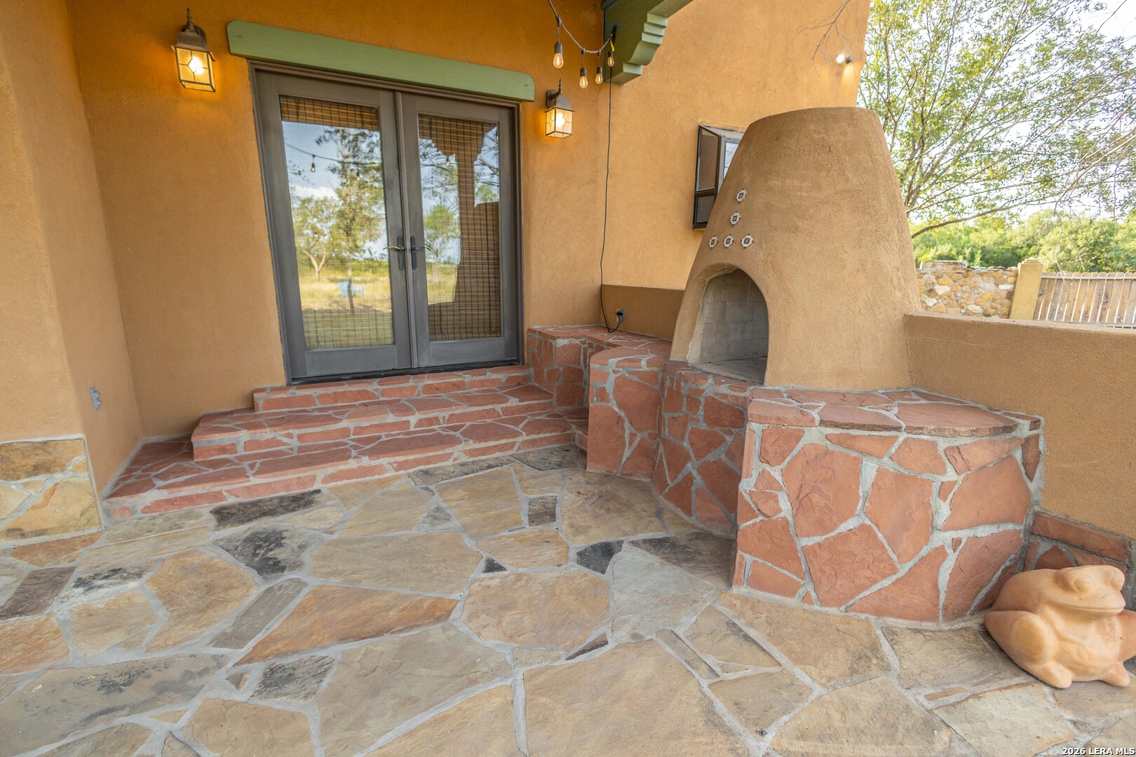 5499 Agape Road Uvalde, TX 78801 - Photo 45 of 54 a view of a door with a chair and a potted plant