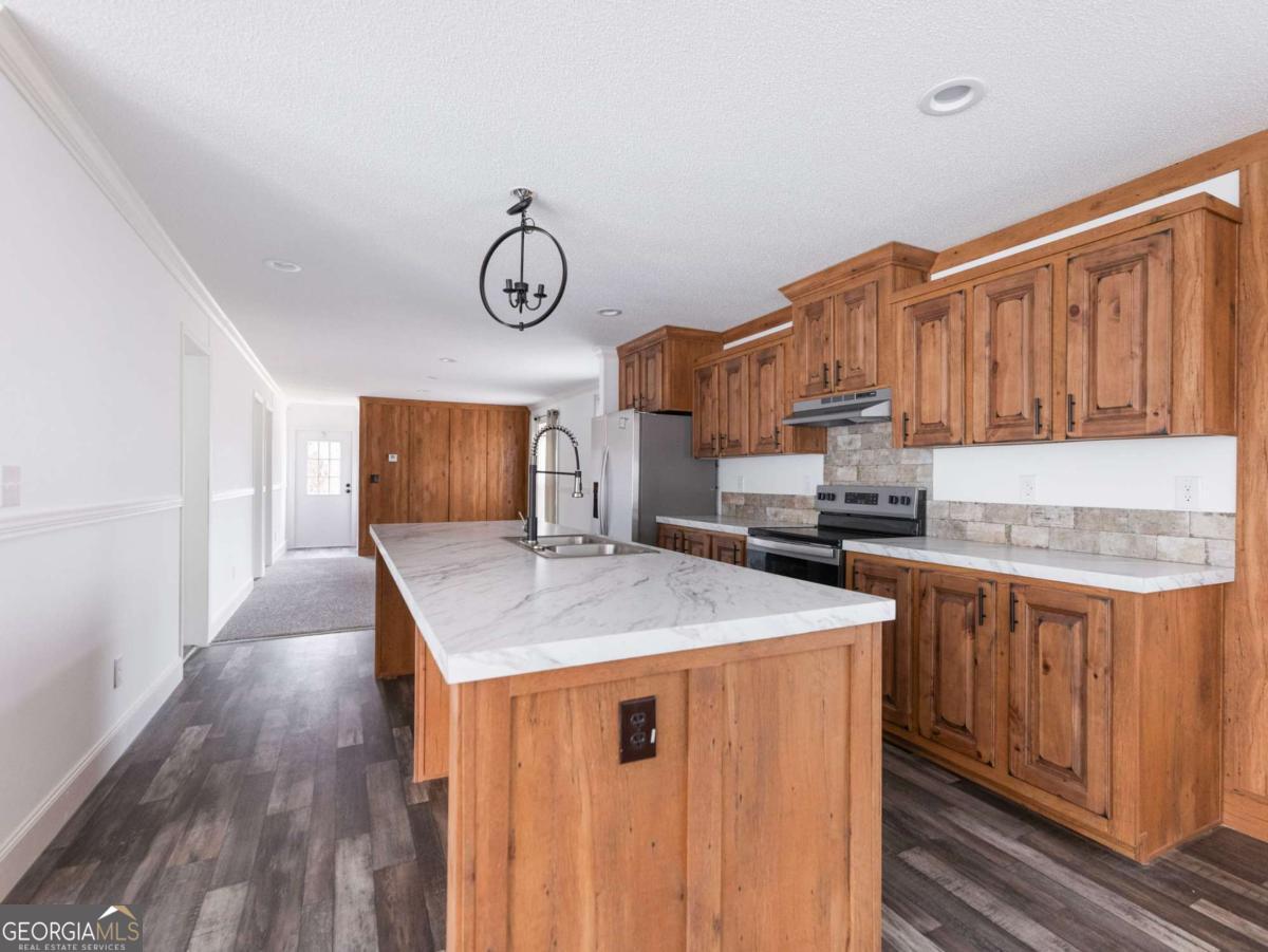 5222 Bogus Road Gainesville, GA 30506 - Photo 14 of 43 a kitchen with a stove and a refrigerator