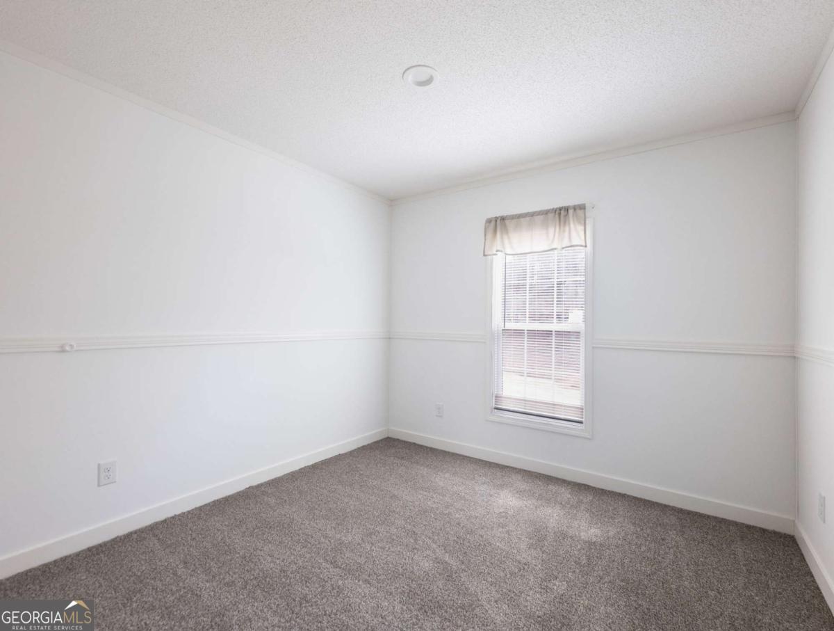 5222 Bogus Road Gainesville, GA 30506 - Photo 20 of 43 an empty room with a window