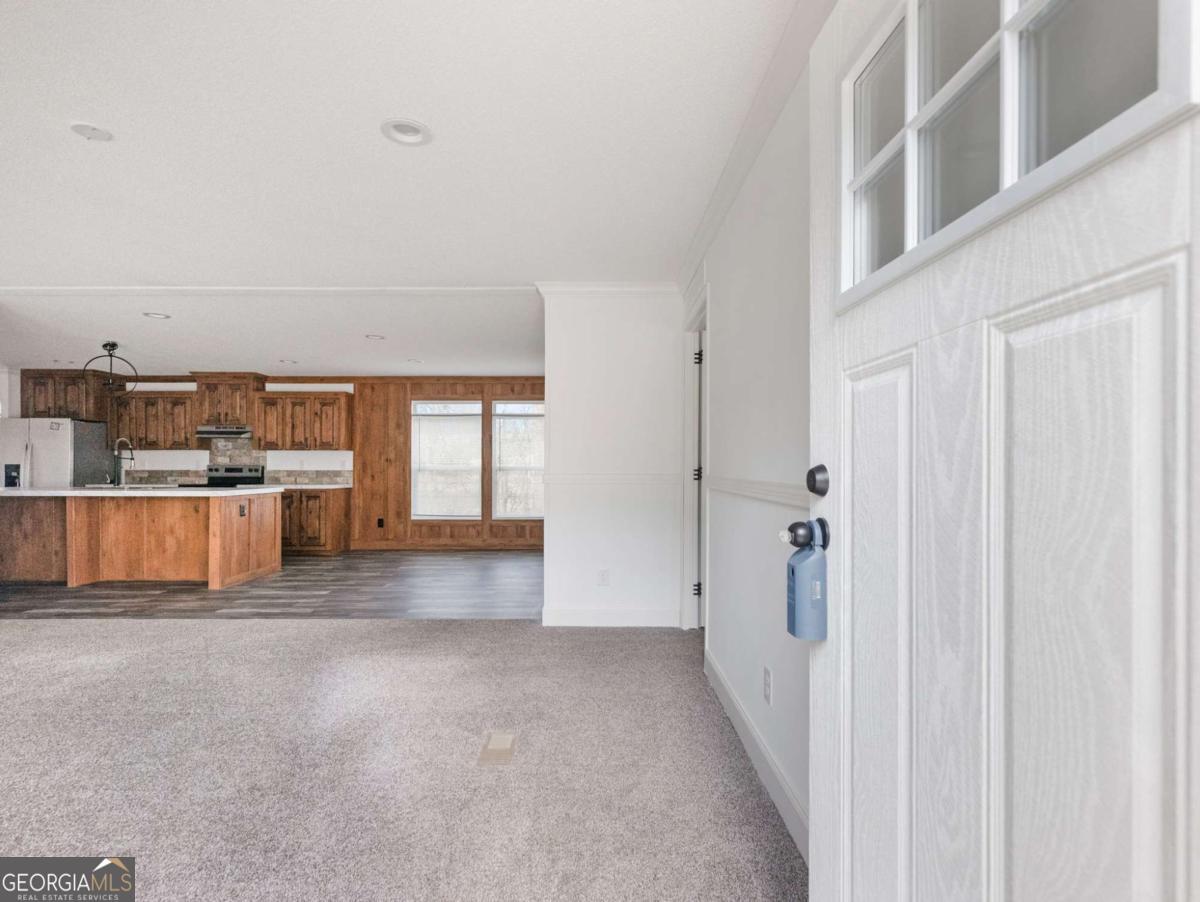 5222 Bogus Road Gainesville, GA 30506 - Photo 2 of 43 a view of a kitchen with a white wall next to a window