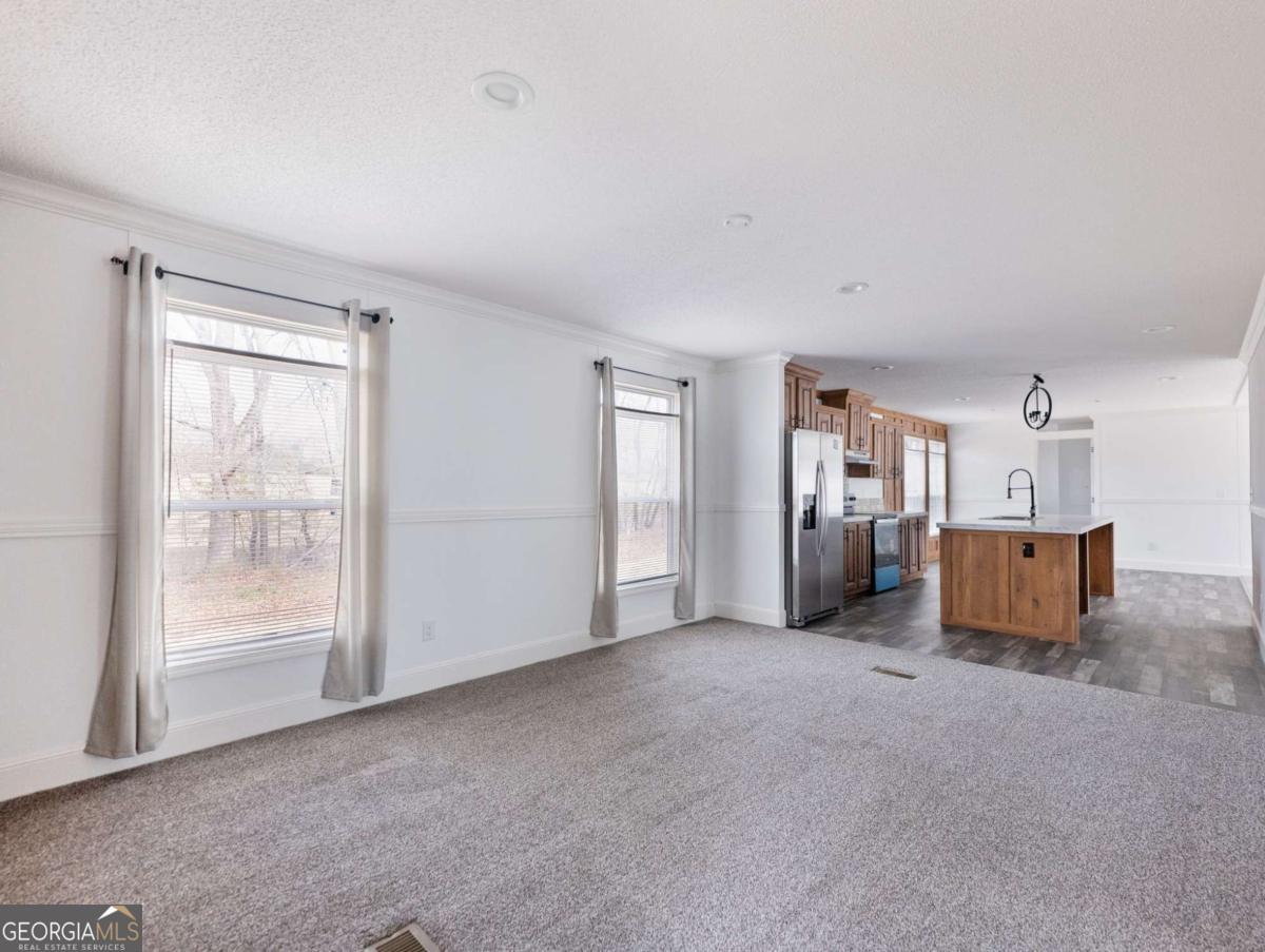 5222 Bogus Road Gainesville, GA 30506 - Photo 22 of 43 a view of empty room with wooden floor