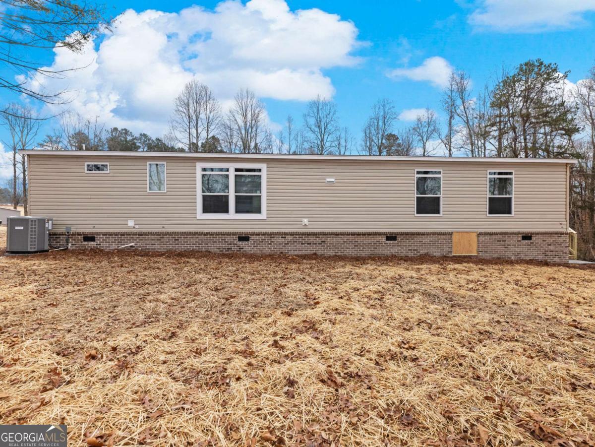 5222 Bogus Road Gainesville, GA 30506 - Photo 38 of 43 a backyard of a house with lots of green space