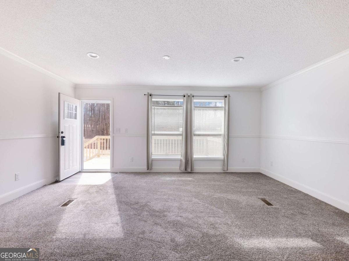 5222 Bogus Road Gainesville, GA 30506 - Photo 4 of 43 a view of an empty room with a window