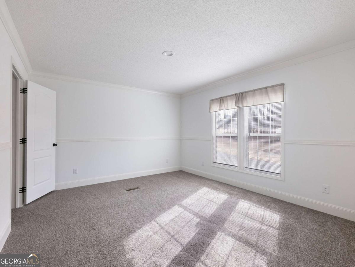 5222 Bogus Road Gainesville, GA 30506 - Photo 6 of 43 a view of an empty room with a window