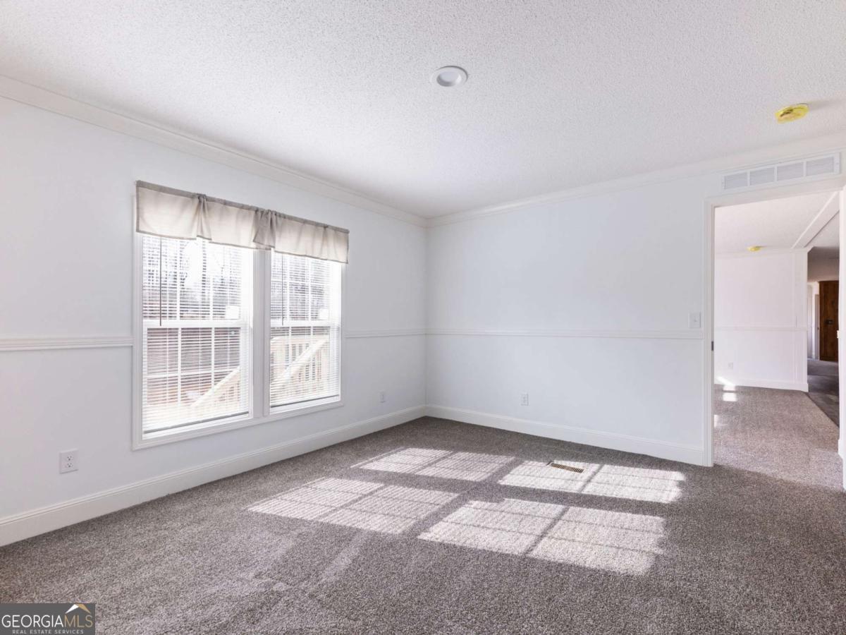 5222 Bogus Road Gainesville, GA 30506 - Photo 8 of 43 a view of an empty room with a window