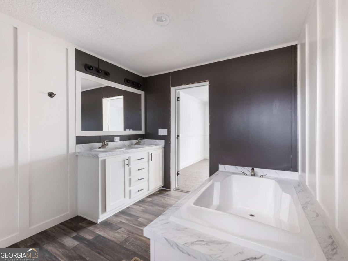 5222 Bogus Road Gainesville, GA 30506 - Photo 10 of 43 a bathroom with a sink and a mirror
