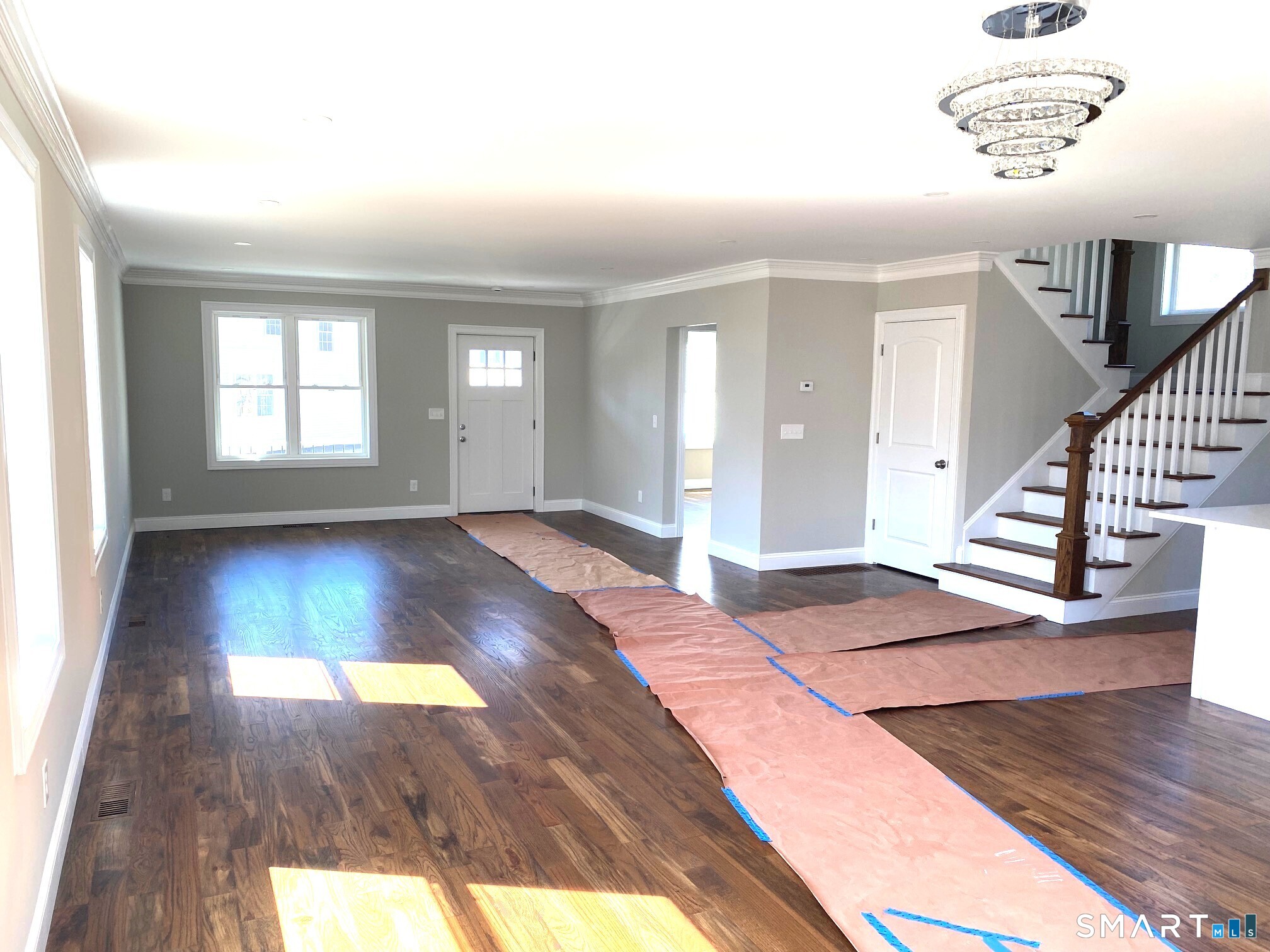 277 Alba Avenue Bridgeport, CT 06606 - Photo 13 of 37 an empty room with wooden floor and windows