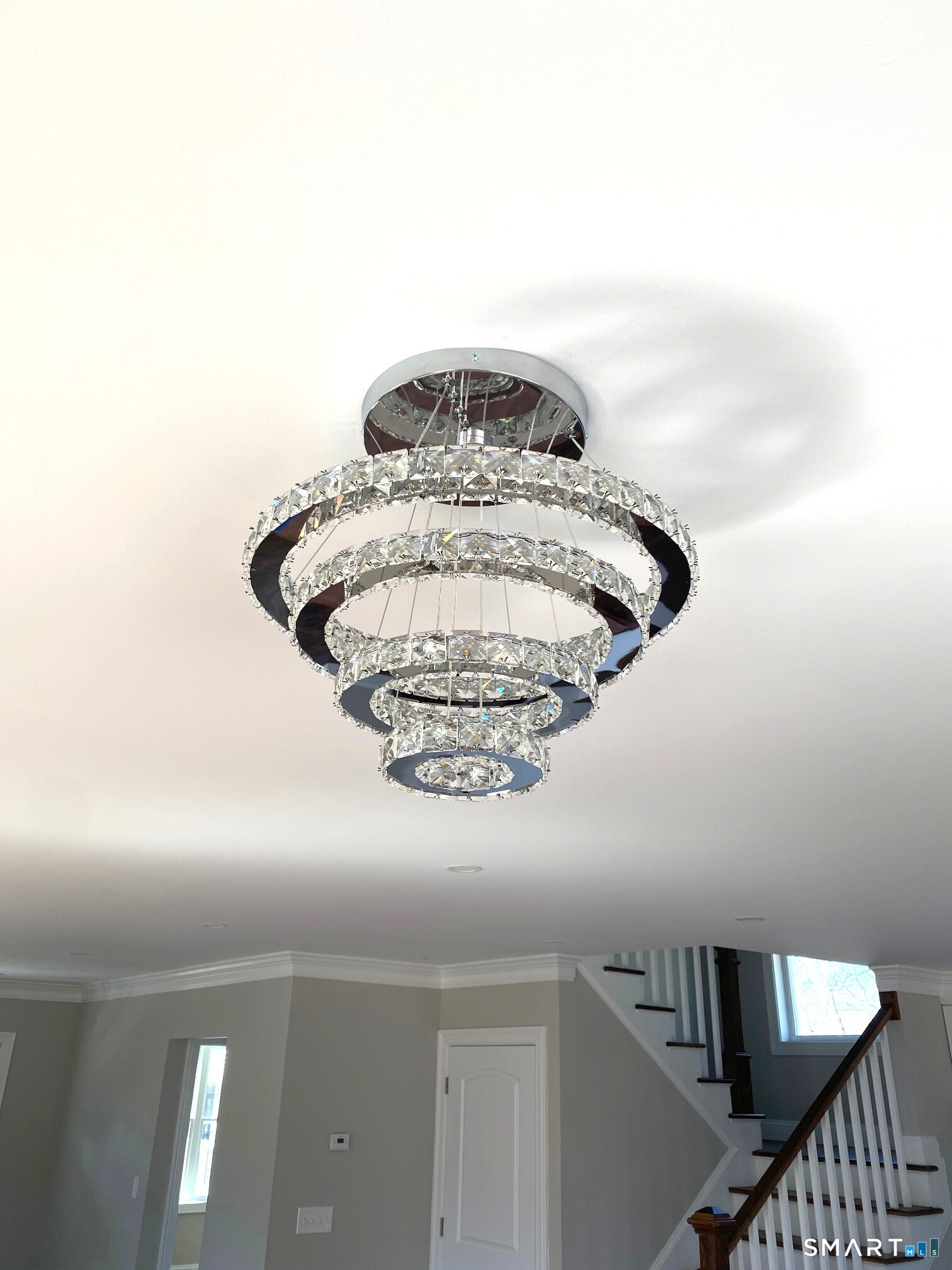 277 Alba Avenue Bridgeport, CT 06606 - Photo 15 of 37 a close view of a chandelier fan and wooden floor